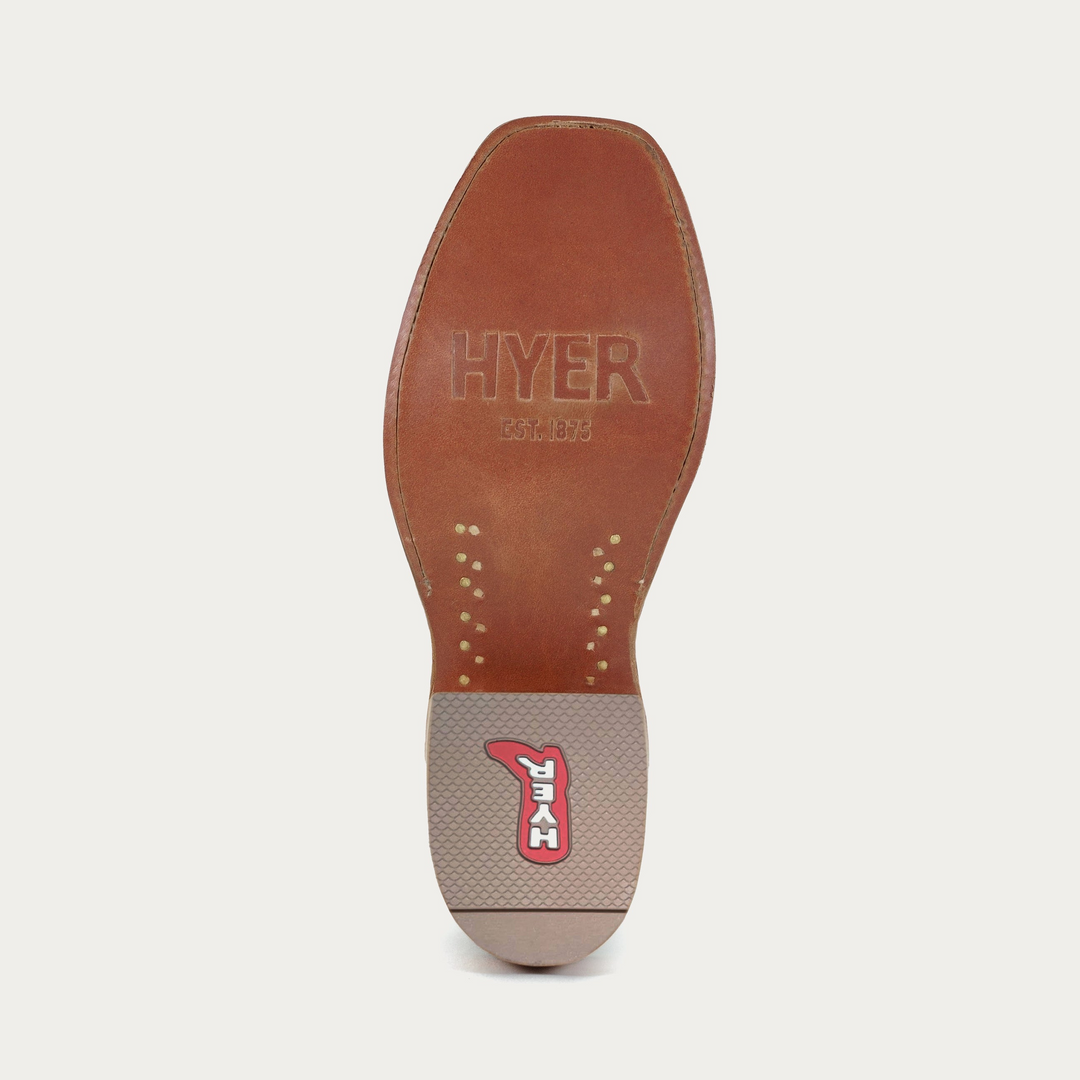Bottom of cowboy boot showing brown leather sole with Hyer branded detailing